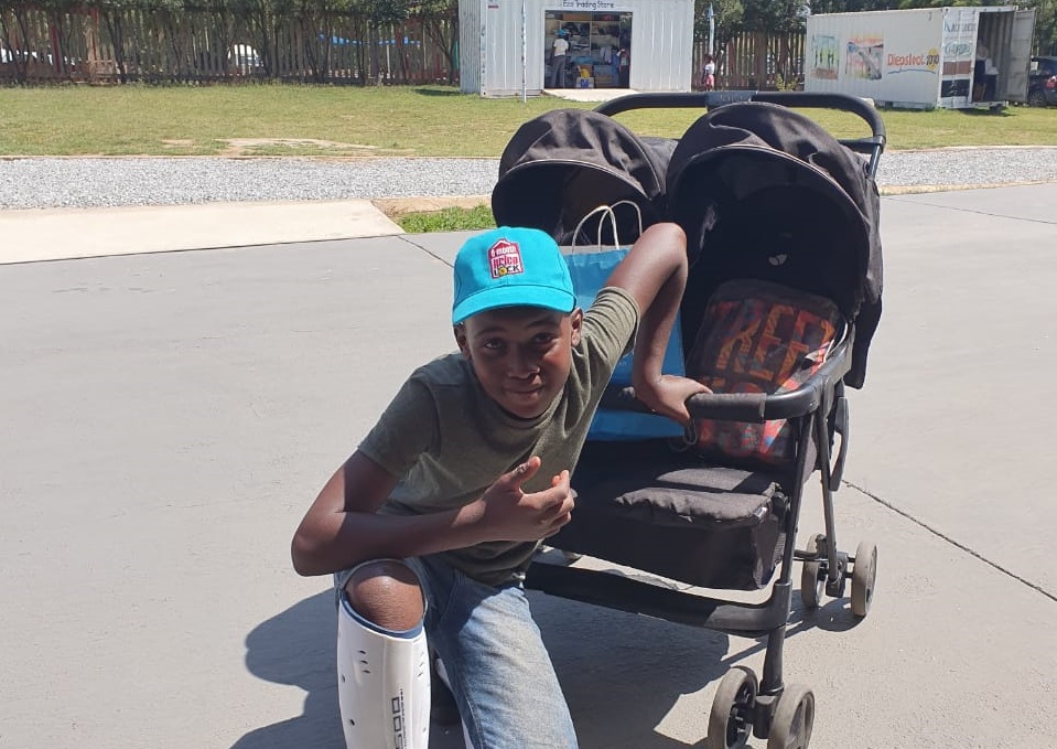 Diepsloot boy with pram purchased in Eco Trading Store